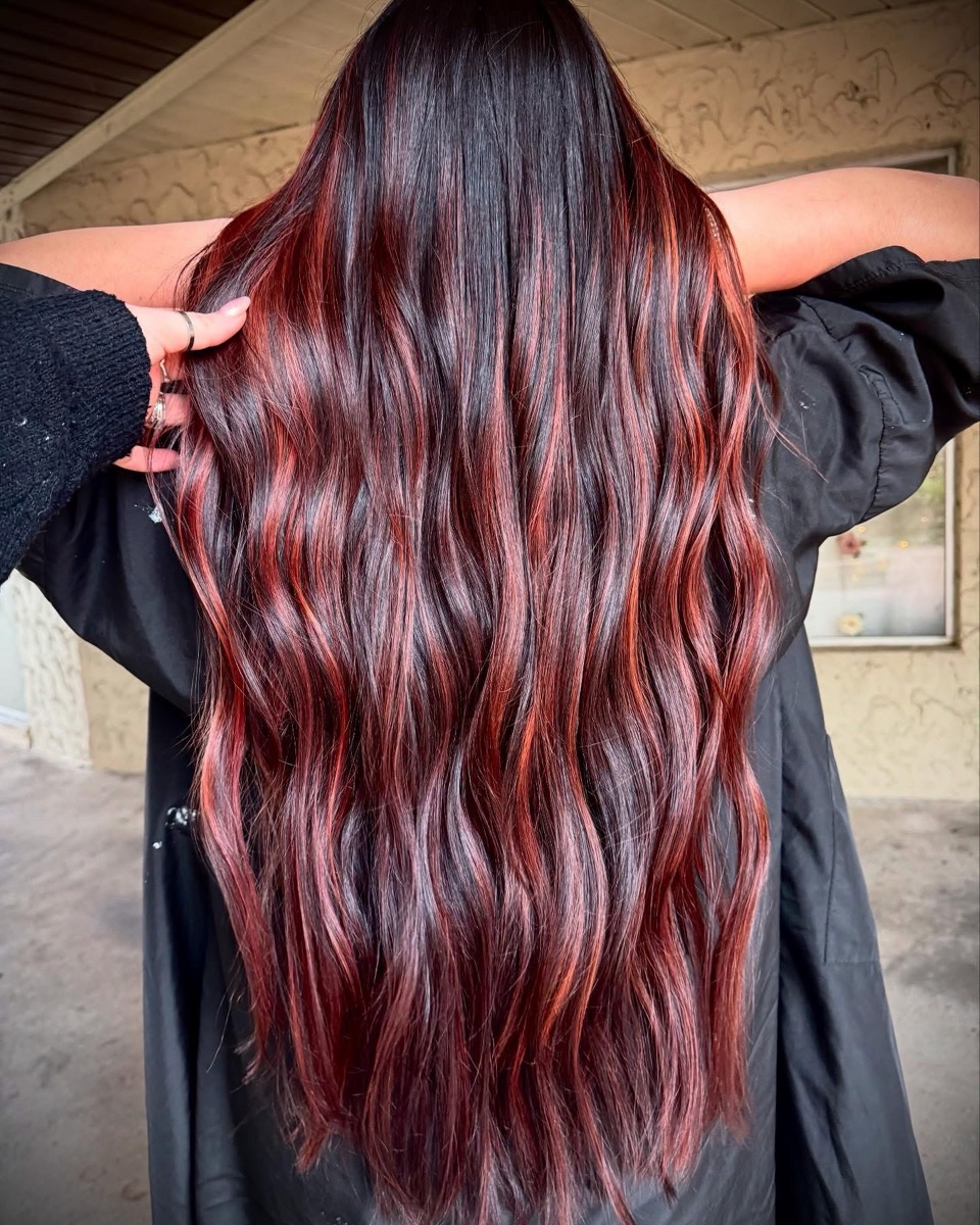 Long dark hair with red ribbons of color